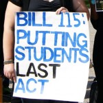 A Bill 115 protest sign.