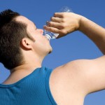 Person drinking bottled water.